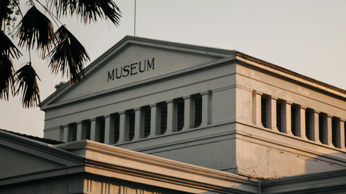 An image of a museum building seen during a sunset